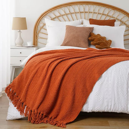 BATTILO HOME Burnt Orange Throw Blanket for Couch, Knit Fall Decor Blanket Versatile for Chair, Decorative Halloween Blanket with Tassels for Bed, 60" x 80"