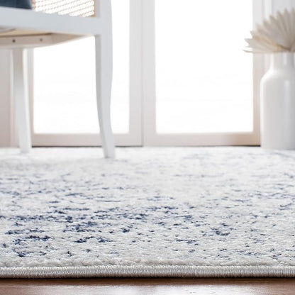 SAFAVIEH Area Rug 10x14 - Adirondack Collection - Large - Ivory & Navy, Distressed Vintage Floral Design, Non-Shedding & Easy to Clean, Ideal for Living Room, Bedroom, Dining Space (ADR109M)