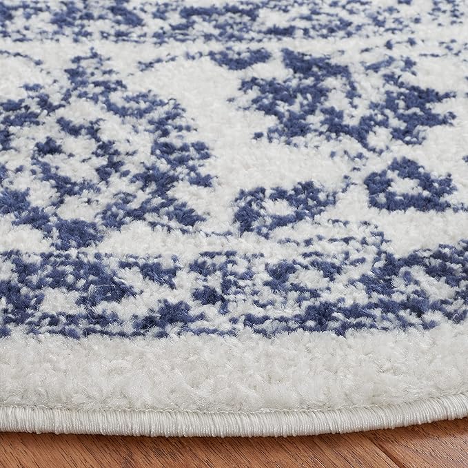 SAFAVIEH Adirondack Collection Area Rug - 10' Round, Ivory & Navy, Distressed Vintage Floral Design, Non-Shedding & Easy to Clean, Ideal for Living Room, Bedroom, Dining (ADR109M)